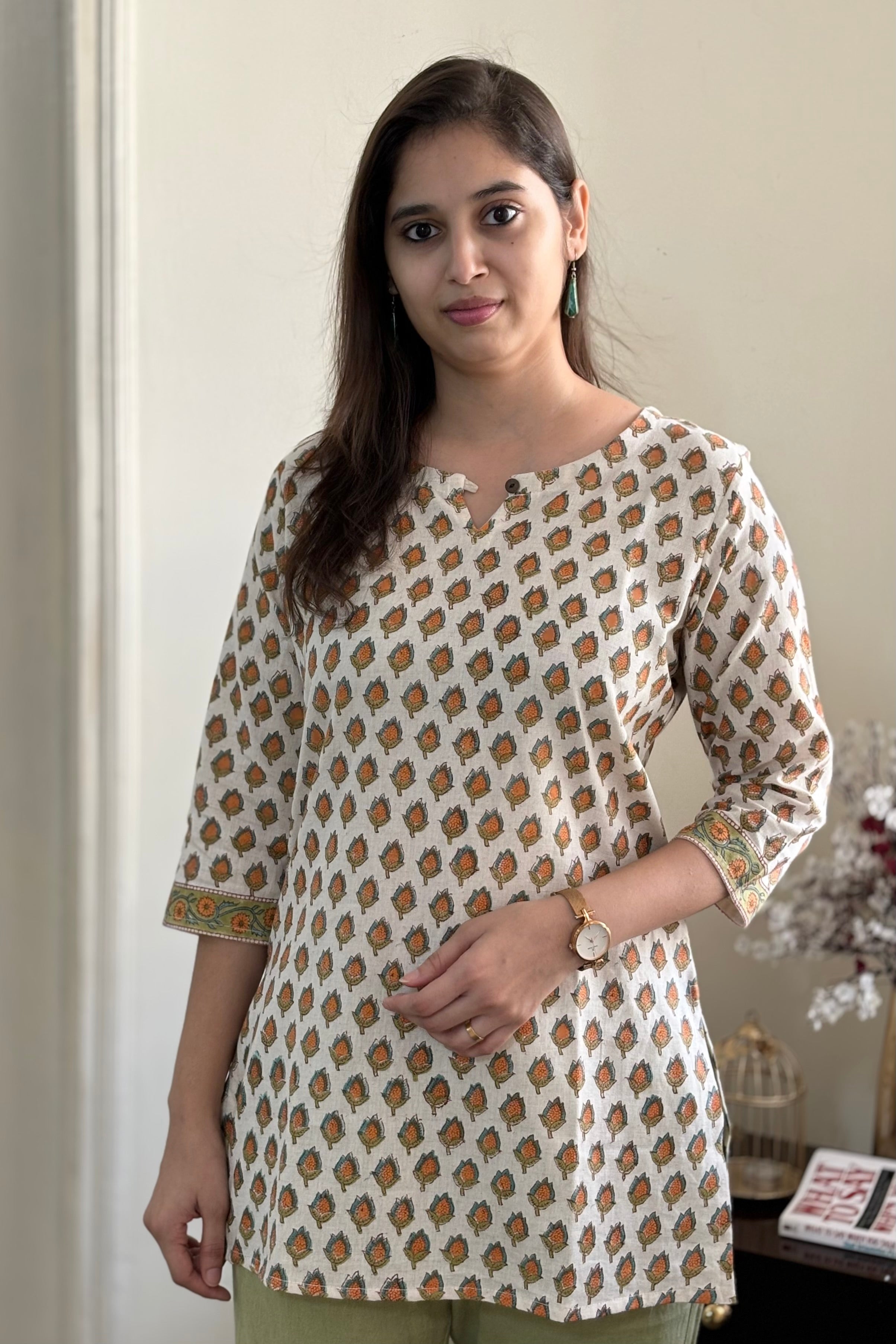 Orange_hand_block_printed_mughal_floral_Buti_on_off-white_cotton_kurti_top