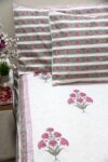 White and pink block printed cotton bedsheet with pillow covers