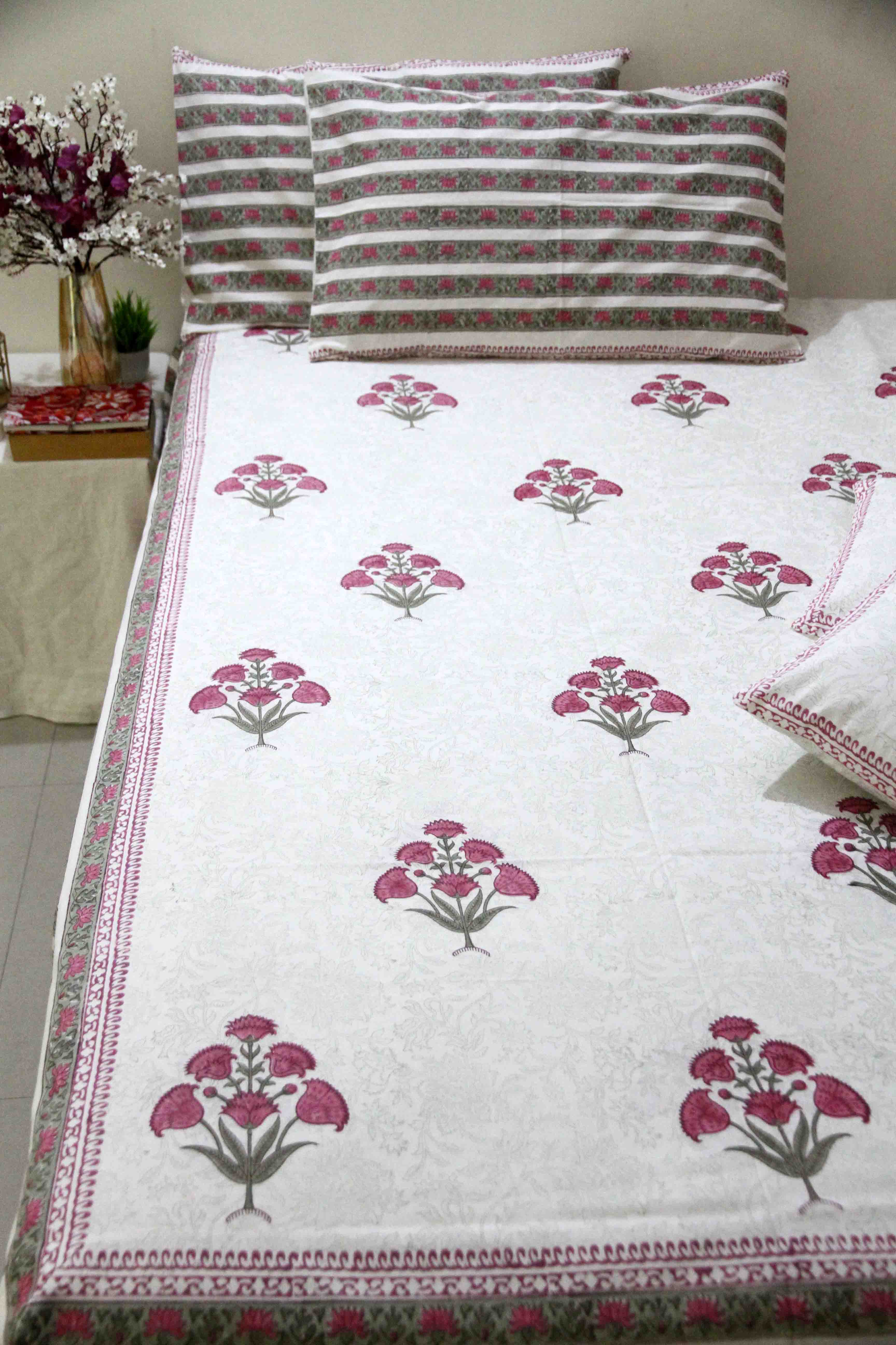 White and pink block printed cotton bedsheet with pillow covers