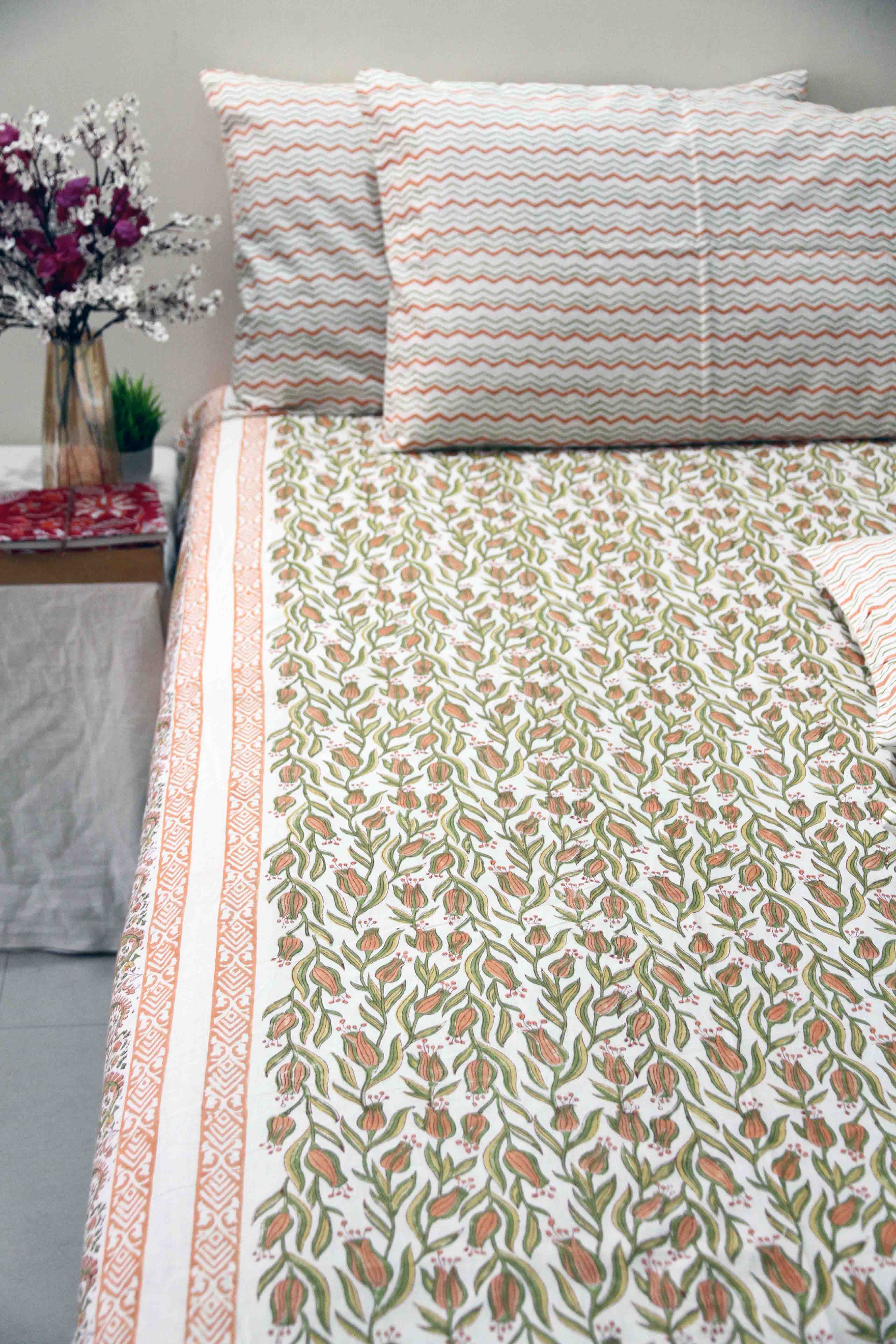 orange and green floral block printed cotton bedsheet with pillow covers