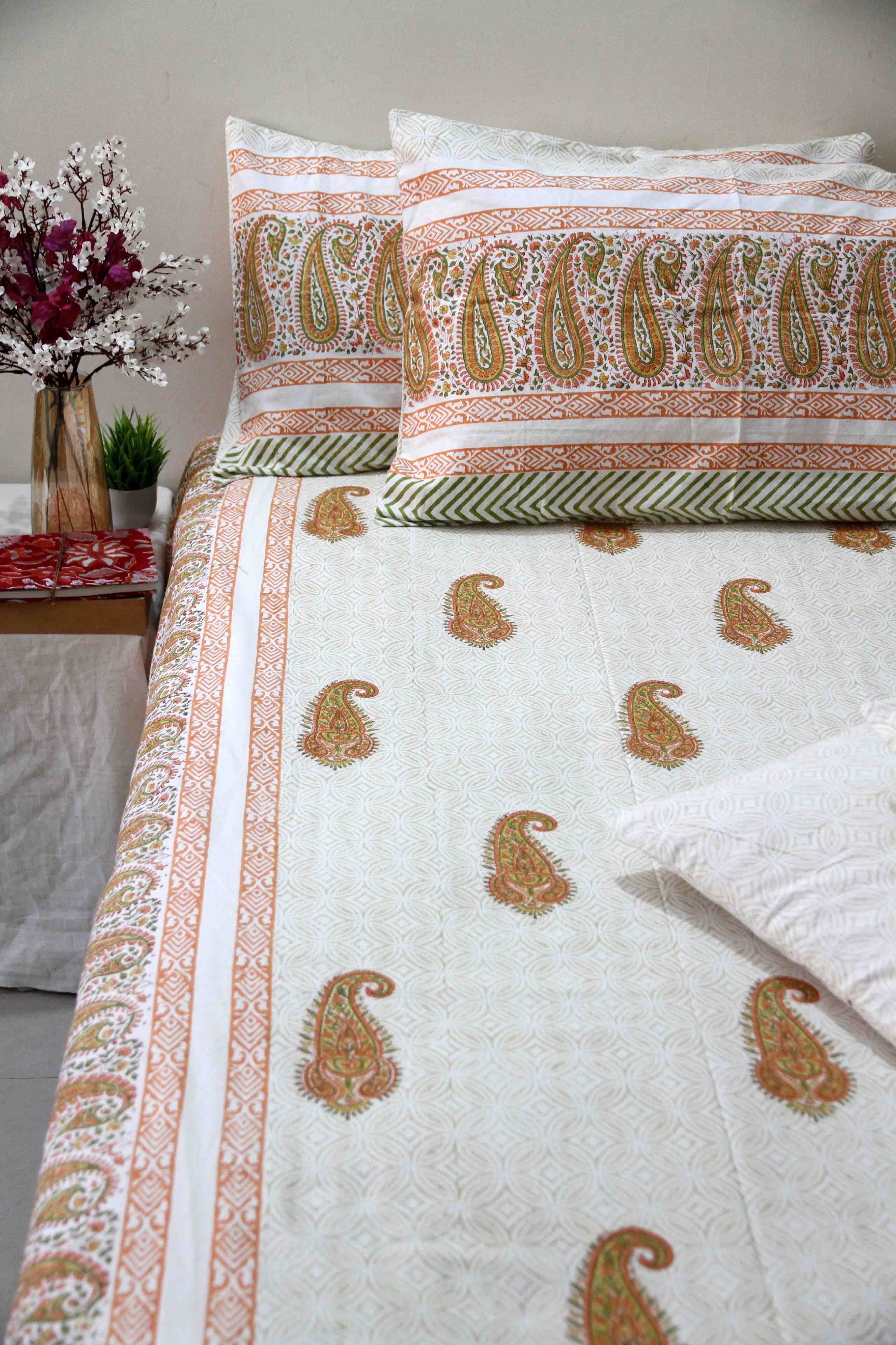 orange and white booti block printed cotton bedsheet with pillow covers