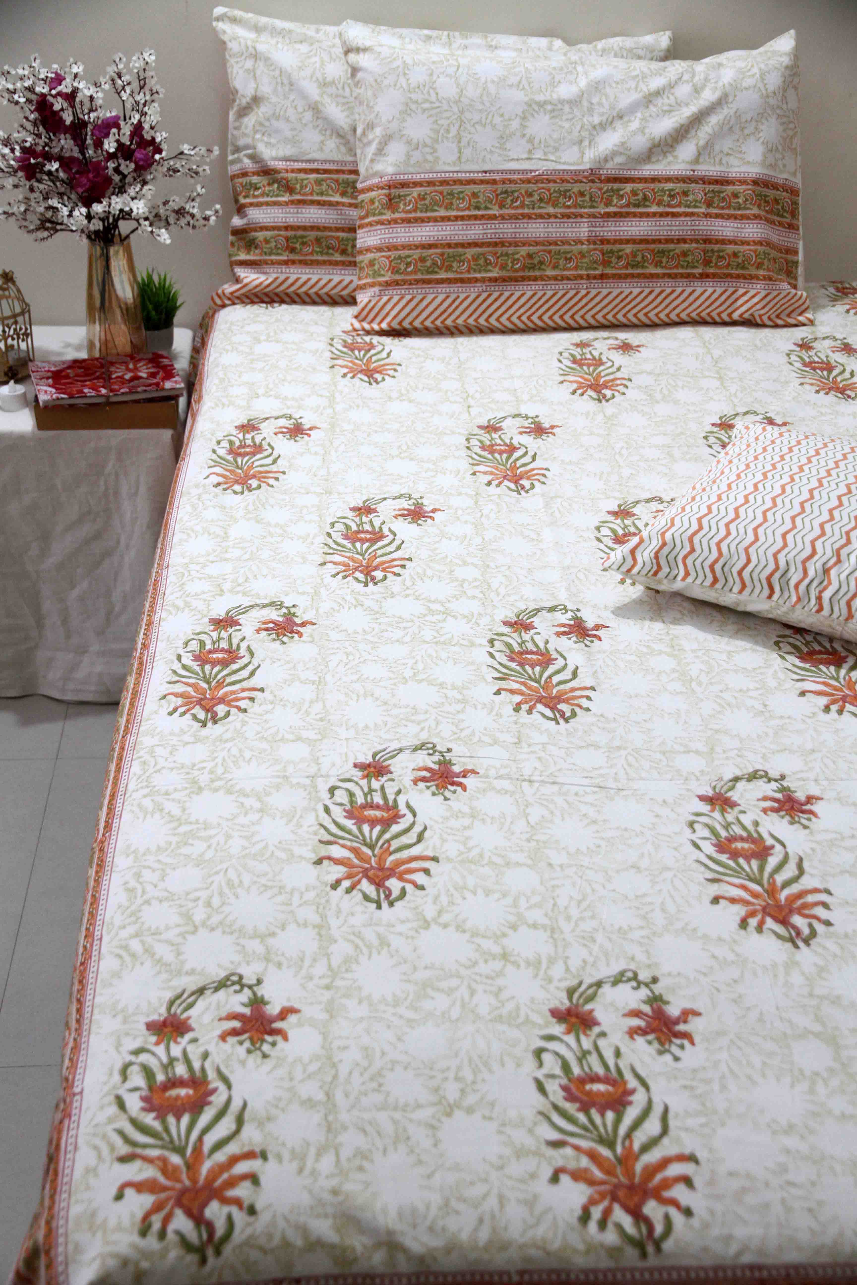 orange and white floral block printed cotton bedsheet with pillow covers